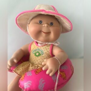 Vintage Cabbage Patch Porcelain Doll with Pink Float and Hat